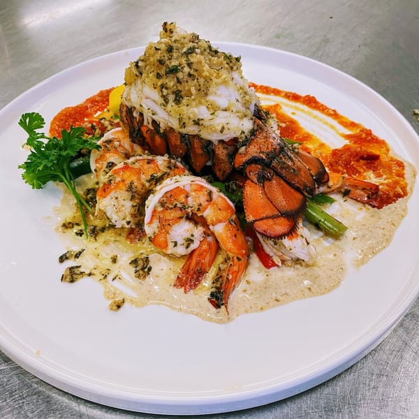 Red Ginger's lobster and shrimp dish, garnished with parsley and served with two sauces.