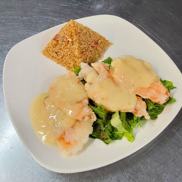 Red Ginger's honey walnut shrimp with fried rice and lettuce on a white plate.