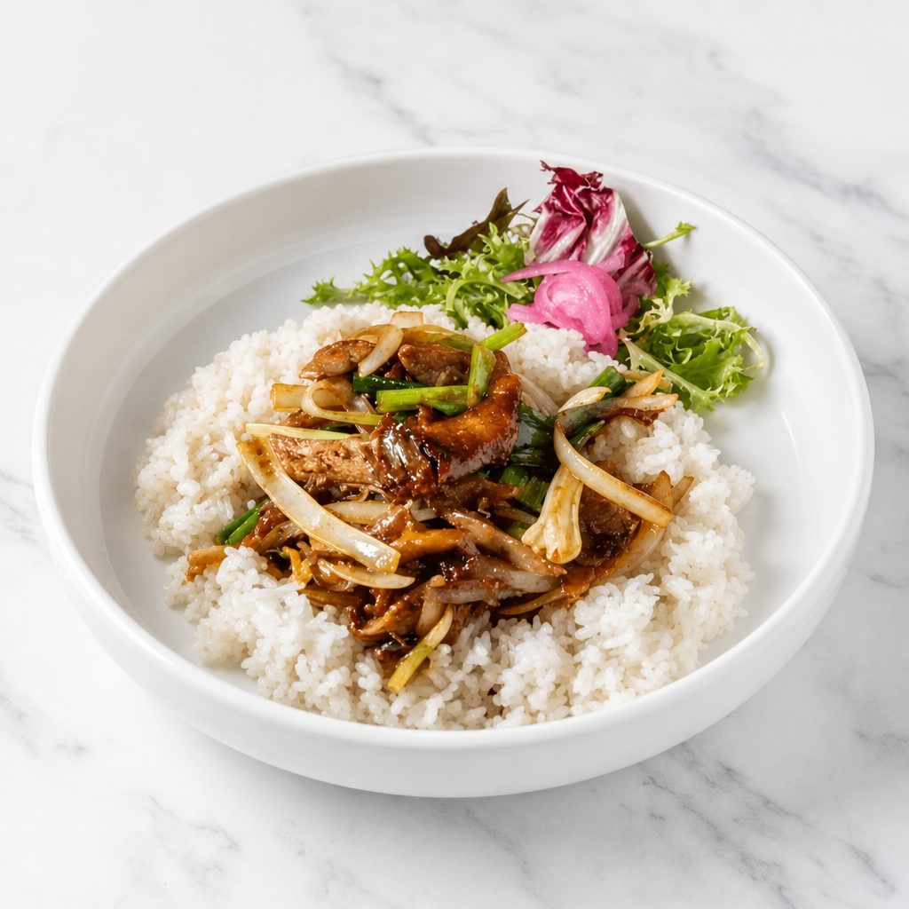 Sliced Duck Sautéed with Ginger & Scallion in Plum Sauce.