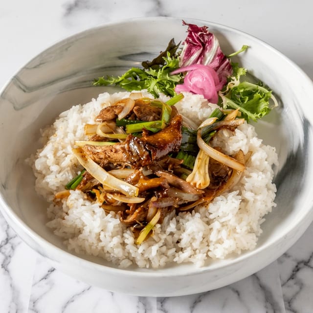 Sliced Duck Sautéed with Ginger & Scallion in Plum Sauce.